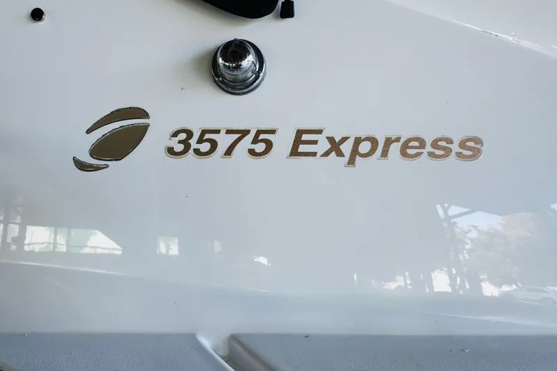 Slide: The Image of 2000 Cruisers Yachts 3575 Express logo on white surface. - 20