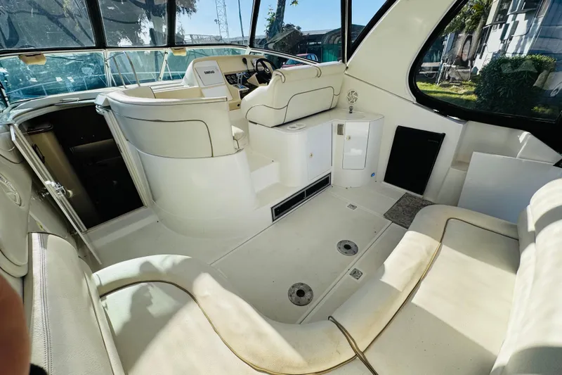 Slide: The Image of Interior of 2000 Cruisers Yachts 3575 Express, featuring helm and seating area. - 25