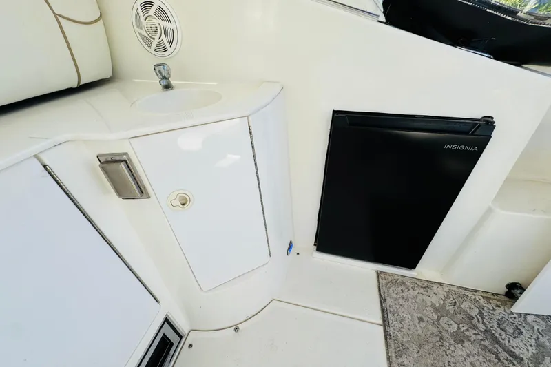Slide: The Image of Interior of 2000 Cruisers Yachts 3575 Express with sink and Insignia fridge. - 27