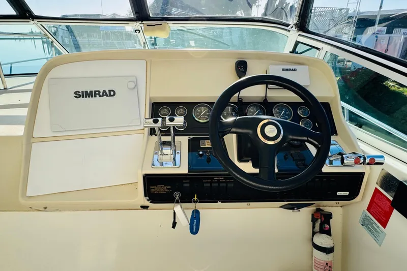Slide: The Image of Helm of 2000 Cruisers Yachts 3575 Express with Simrad navigation system. - 33