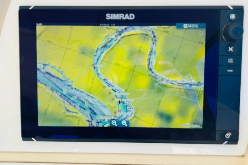Slide: The Image of Simrad navigation display on 2000 Cruisers Yachts 3575 Express, showing a detailed river map. - 36