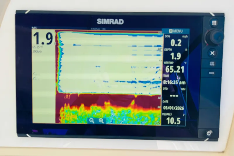 Slide: The Image of Simrad marine display on 2000 Cruisers Yachts 3575 Express, showing sonar and navigation data. - 38