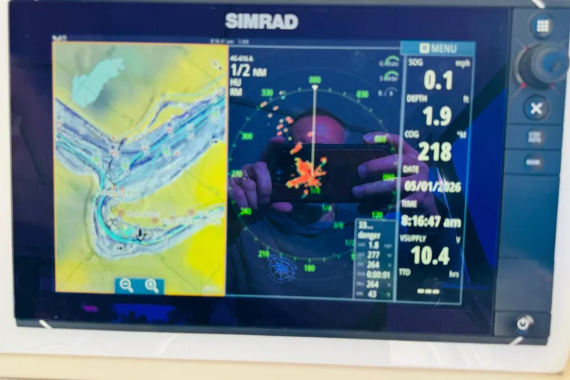 Slide: The Image of Simrad navigation display on 2000 Cruisers Yachts 3575 Express showing map and data. - 39