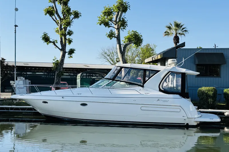 Slide: The Image of 2000 Cruisers Yachts 3575 Express docked, showcasing sleek design and modern features. - 4