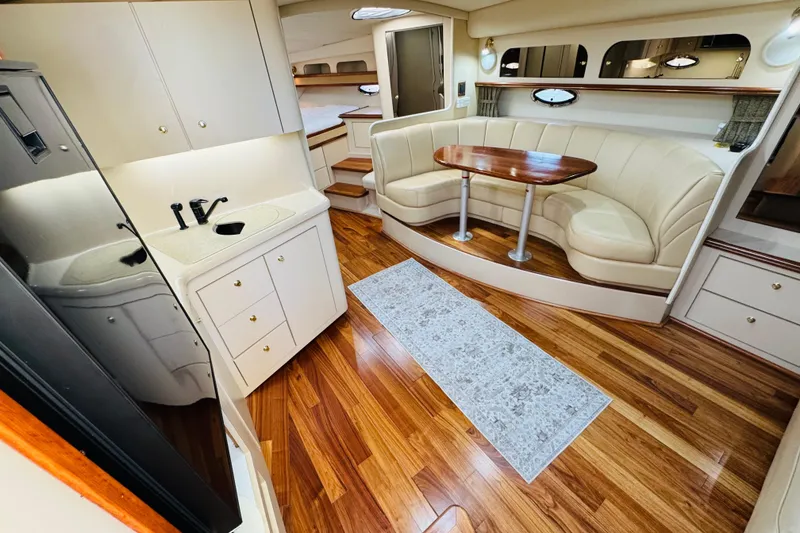 Slide: The Image of Luxurious interior of 2000 Cruisers Yachts 3575 Express with elegant seating and kitchenette. - 42