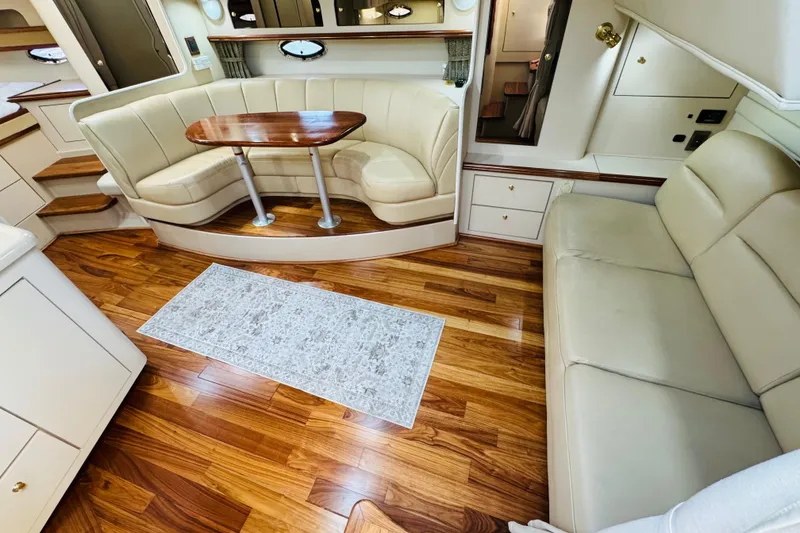 Slide: The Image of Luxurious interior of 2000 Cruisers Yachts 3575 Express with elegant seating and wooden flooring. - 43