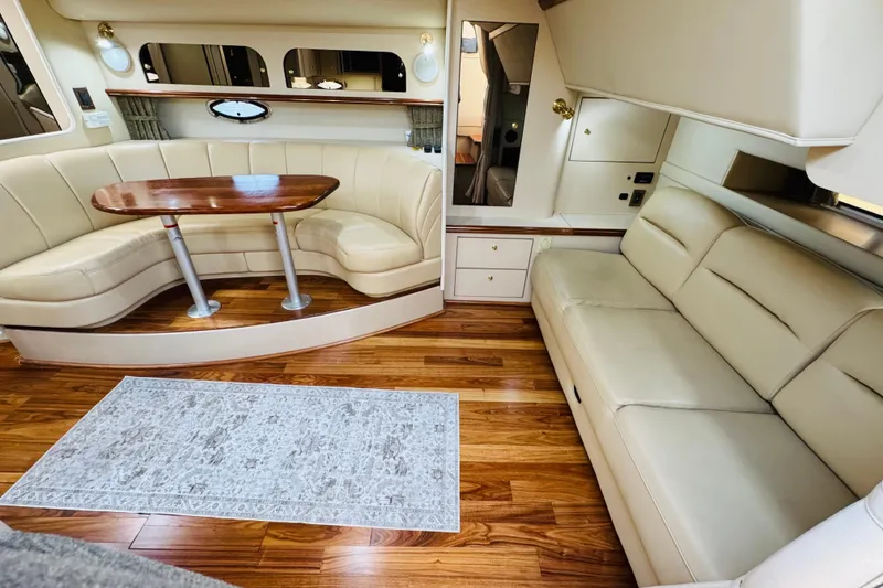 Slide: The Image of Luxurious interior of 2000 Cruisers Yachts 3575 Express with leather seating and wooden flooring. - 45