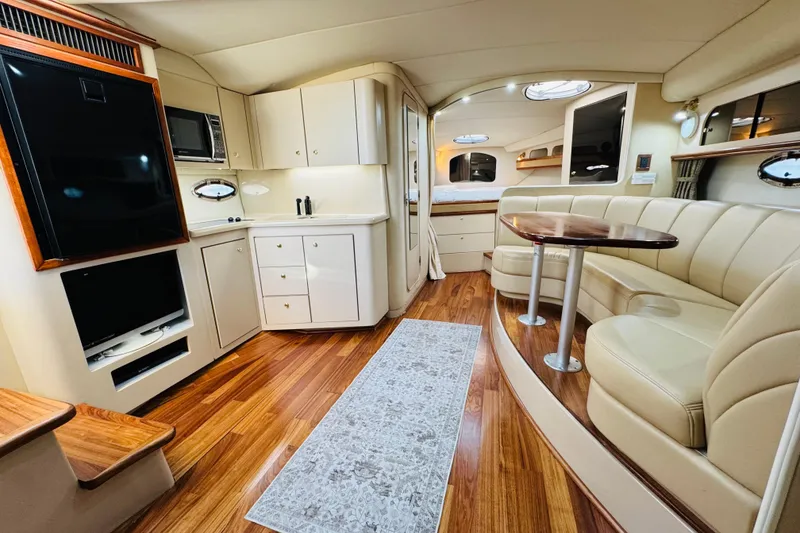 Slide: The Image of Luxurious interior of 2000 Cruisers Yachts 3575 Express with elegant seating and modern amenities. - 46