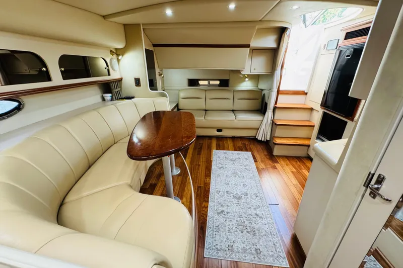 Slide: The Image of Luxurious interior of 2000 Cruisers Yachts 3575 Express with elegant seating and wooden flooring. - 47