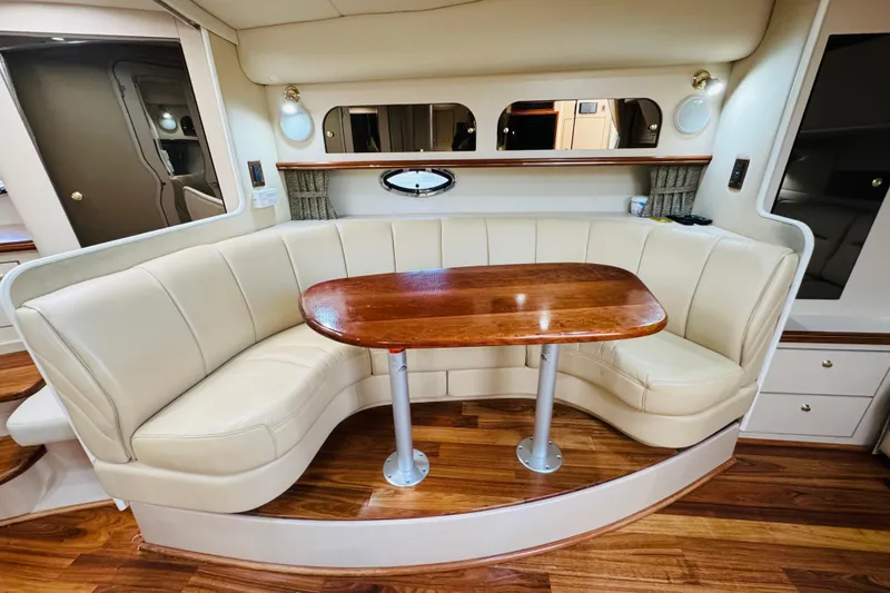 Slide: The Image of Luxurious interior of 2000 Cruisers Yachts 3575 Express with elegant seating and wooden table. - 51