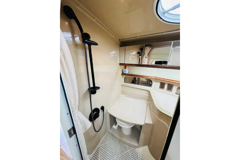 Slide: The Image of Bathroom interior of 2000 Cruisers Yachts 3575 Express, featuring shower and sink. - 57