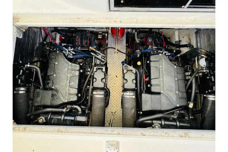 Slide: The Image of Engine compartment of a 2000 Cruisers Yachts 3575 Express, featuring dual V8 engines. - 60
