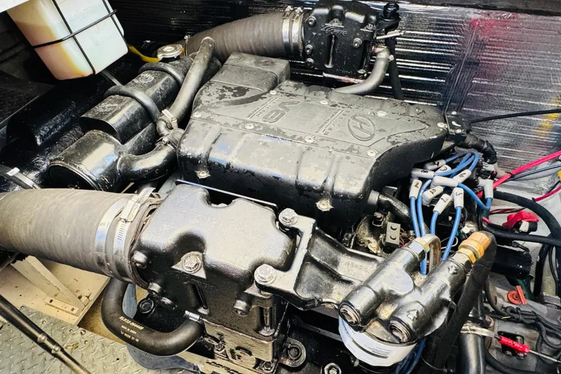 Slide: The Image of Engine of a 2000 Cruisers Yachts 3575 Express, showcasing detailed mechanical components. - 61