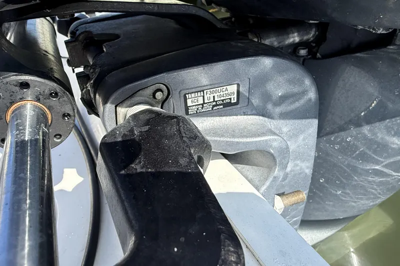 Slide: The Image of Close-up of a Yamaha F300UCA engine part on a 2018 Robalo R247 Dual Console boat. - 12