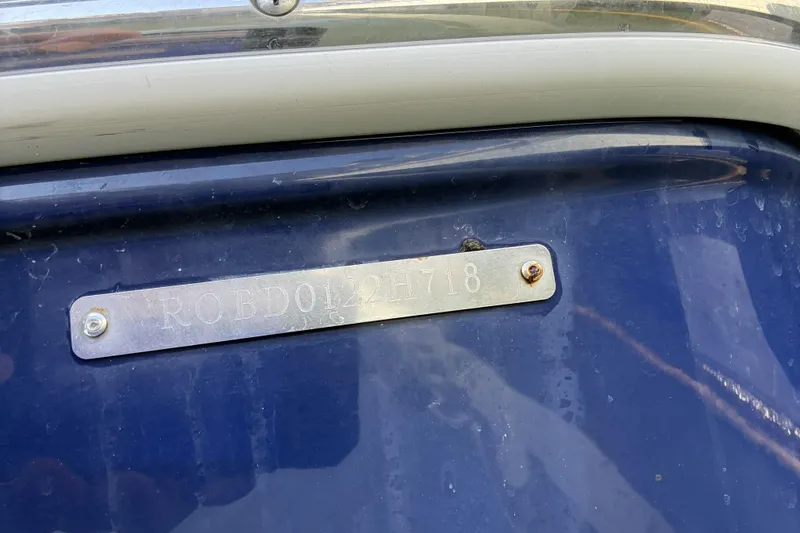Slide: The Image of 2018 Robalo R247 Dual Console boat hull identification number plate. - 7