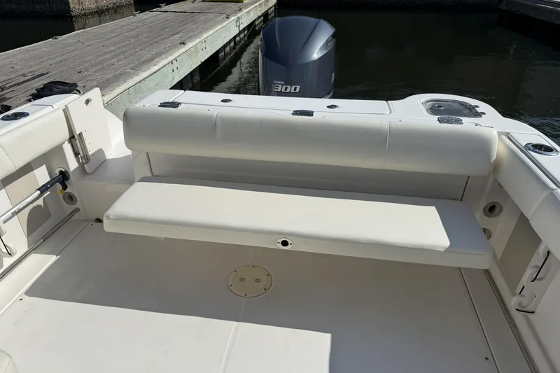 Slide: The Image of 2018 Robalo R247 Dual Console boat with Yamaha 300 engine, docked at marina. - 9
