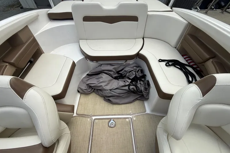 Slide: The Image of Interior of 2016 Chaparral 226 SSi Wide Tech boat with beige and brown seating. - 12
