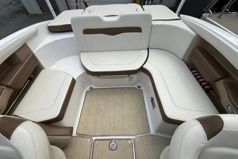 Slide: The Image of 2016 Chaparral 226 SSi Wide Tech boat interior with white and brown seating. - 13