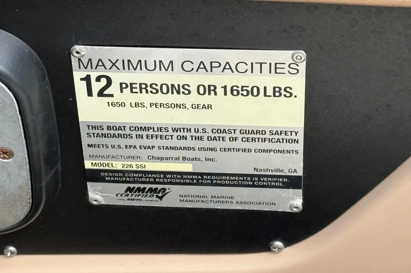 Slide: The Image of Capacity label for 2016 Chaparral 226 SSi Wide Tech, 12 persons or 1650 lbs. - 17