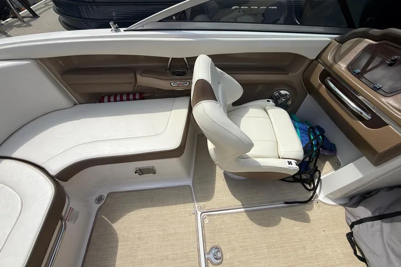 Slide: The Image of Interior of a 2016 Chaparral 226 SSi Wide Tech boat with beige seating. - 19
