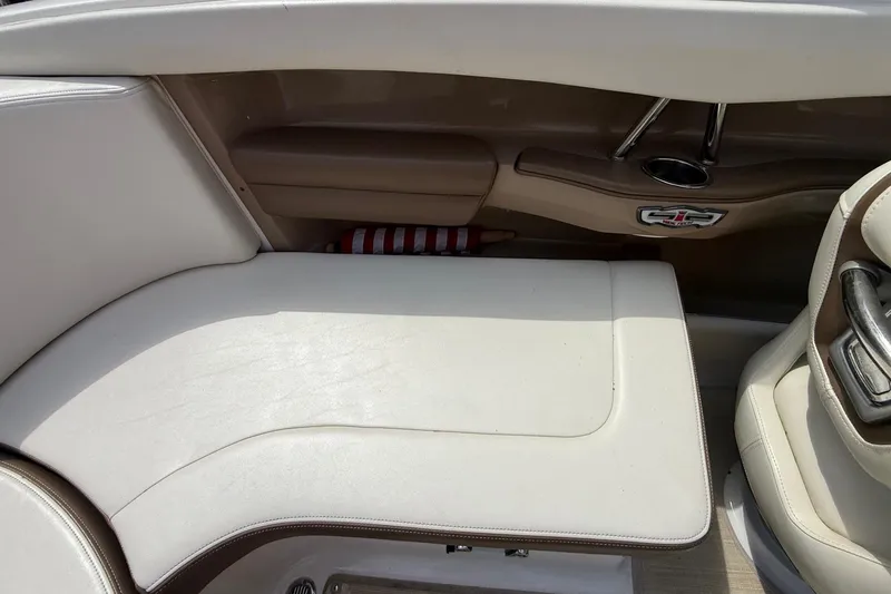 Slide: The Image of Interior seating of 2016 Chaparral 226 SSi Wide Tech boat, featuring beige upholstery. - 20