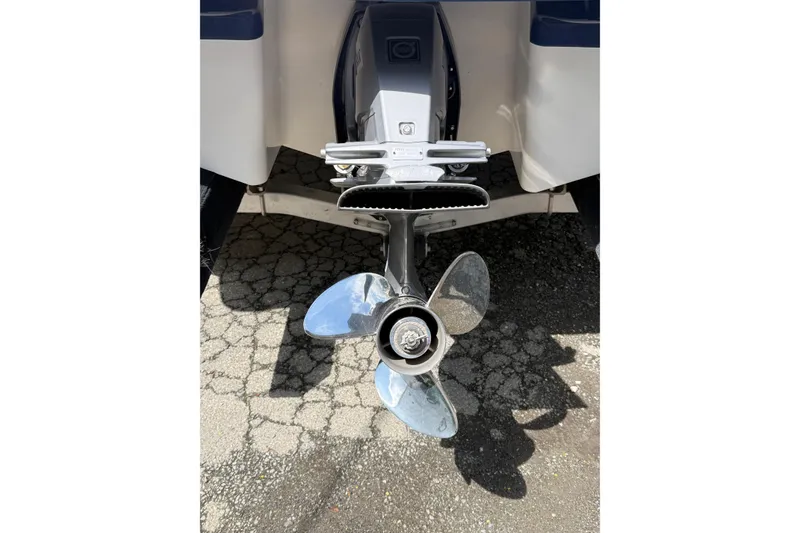 Slide: The Image of 2016 Chaparral 226 SSi Wide Tech boat propeller on pavement background. - 22