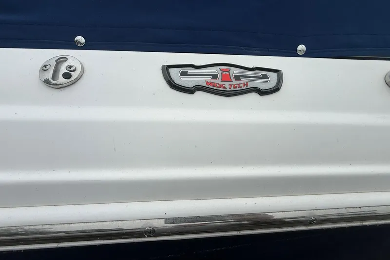 Slide: The Image of 2016 Chaparral 226 SSi Wide Tech boat emblem on white surface. - 3