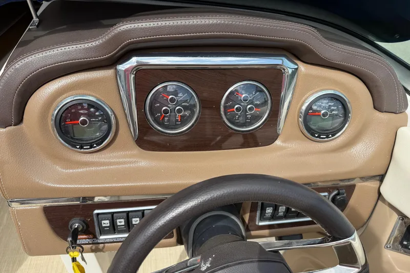 Slide: The Image of Dashboard of 2016 Chaparral 226 SSi Wide Tech boat with gauges and controls. - 7