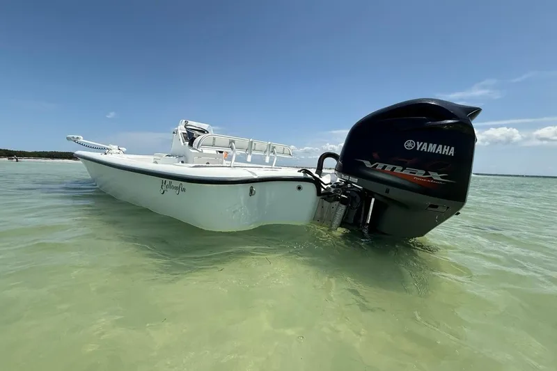 Slide: The Image of 2013 Yellowfin 21 Bay boat with Yamaha VMAX engine in shallow water. - 2