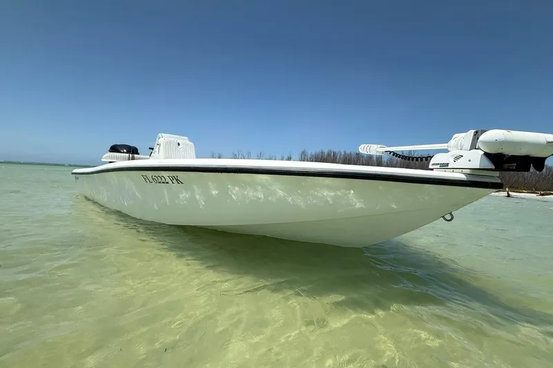 Slide: The Image of 2013 Yellowfin 21 Bay boat in shallow water, clear sky background. - 22