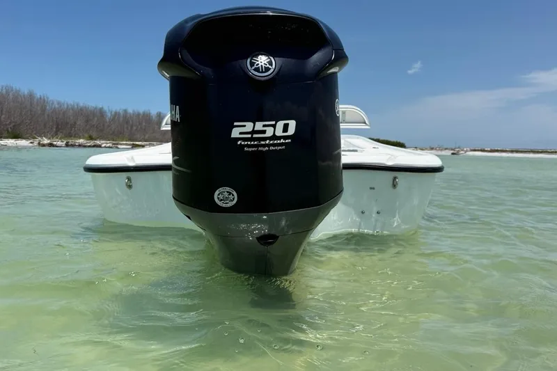 Slide: The Image of 2013 Yellowfin 21 Bay boat with Yamaha 250 engine in shallow clear water. - 3