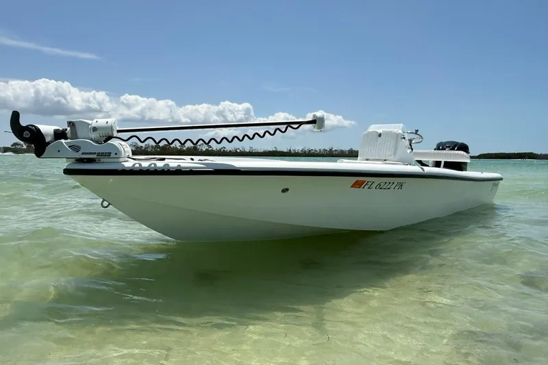 Slide: The Image of 2013 Yellowfin 21 Bay boat in shallow water under clear blue sky. - 9
