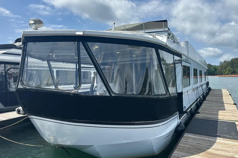 The Image of 1990 Lazy Days 14x72 houseboat docked on a sunny day with clear skies. - 0