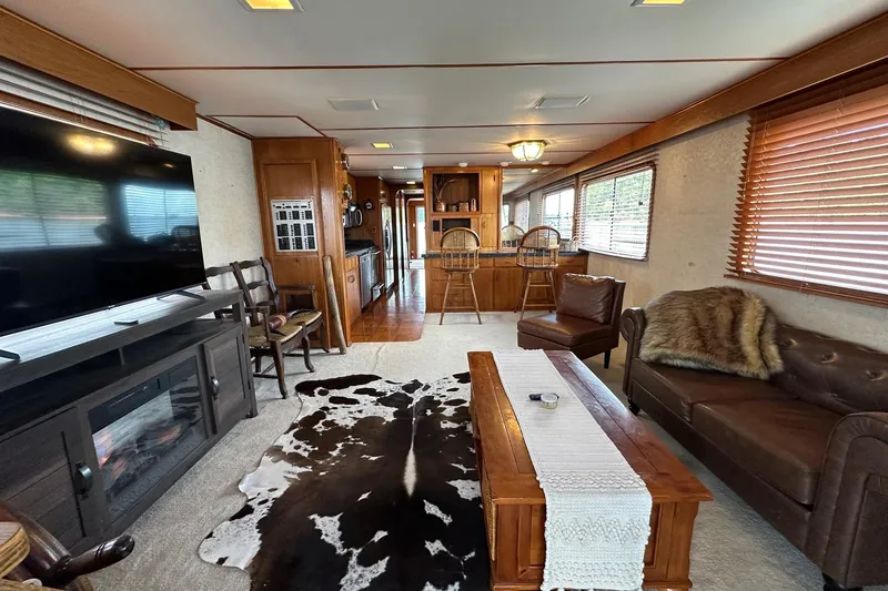 Slide: The Image of Interior of a 1990 Lazy Days 14x72 houseboat with cozy living area and modern amenities. - 2
