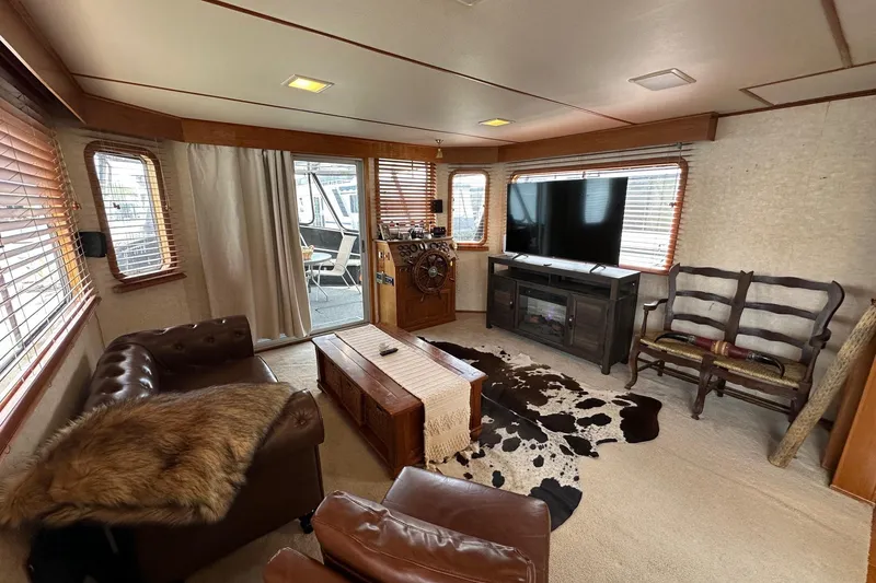 Slide: The Image of Cozy 1990 Lazy Days 14x72 houseboat interior with rustic decor and modern amenities. - 3