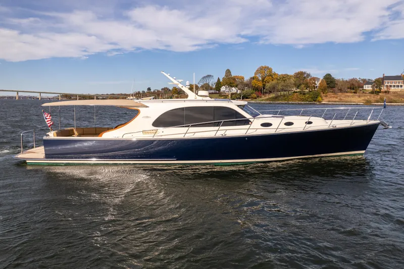 Slide: The Image of 2016 Palm Beach Motor Yachts PB50 cruising on a scenic waterway. - 1