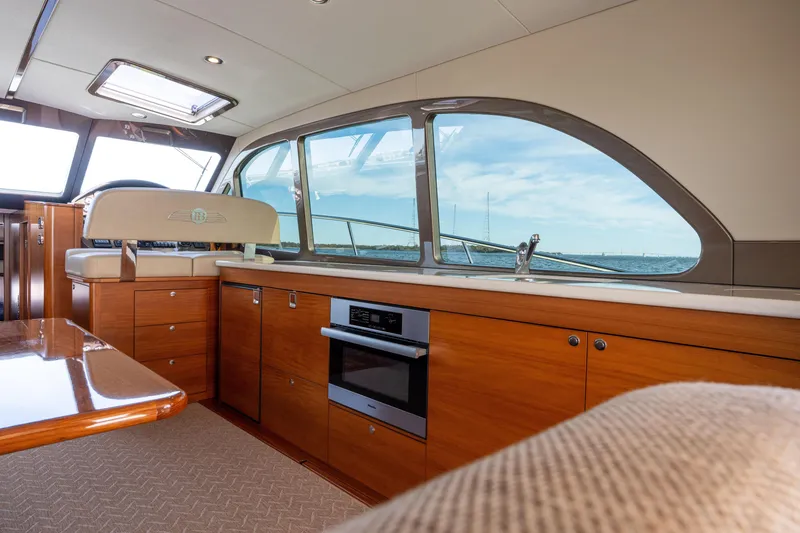 Slide: The Image of Luxurious interior of 2016 Palm Beach Motor Yachts PB50 with elegant wood finish and ocean view. - 41