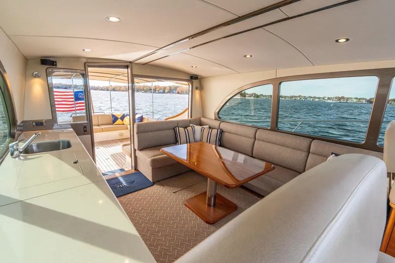 Slide: The Image of Luxurious interior of 2016 Palm Beach Motor Yachts PB50 with elegant seating and scenic water view. - 47