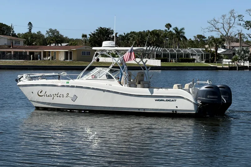 Slide: The Image of 2017 World Cat 255 DC boat on water, displaying "Chapter 2" name and dual Yamaha engines. - 1