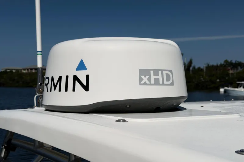 Slide: The Image of Garmin xHD radar on 2017 World Cat 255 DC boat, with clear blue sky background. - 14