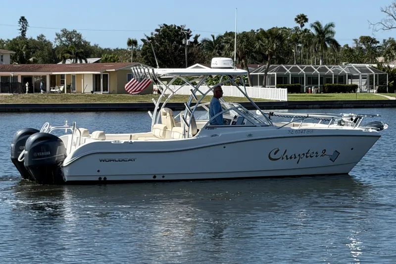 Slide: The Image of 2017 World Cat 255 DC boat on water, featuring dual Yamaha engines and "Chapter 2" name. - 20