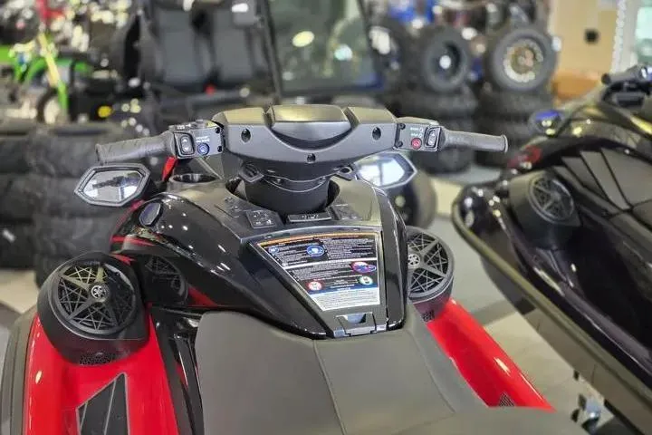 Slide: The Image of 2026 Yamaha WaveRunner FX Cruiser HO, featuring sleek handlebars and advanced controls in a showroom. - 13