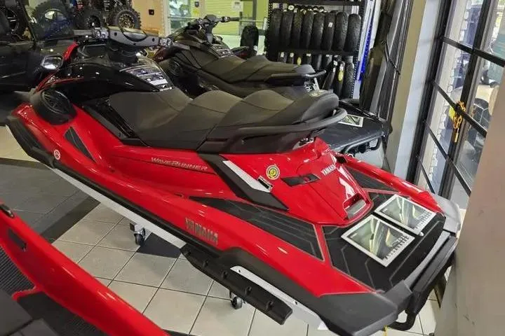 Slide: The Image of 2026 Yamaha WaveRunner FX Cruiser HO in showroom, red and black design. - 4