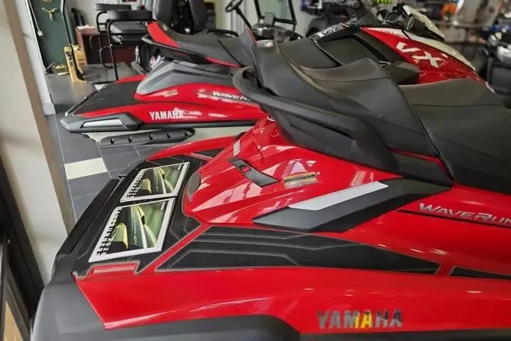 Slide: The Image of 2026 Yamaha WaveRunner FX Cruiser HO in showroom, vibrant red color, sleek design. - 5
