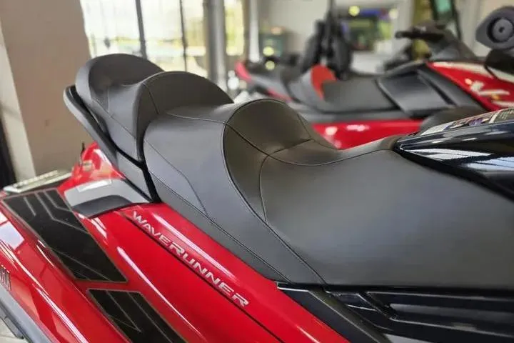 Slide: The Image of 2026 Yamaha WaveRunner FX Cruiser HO, red with sleek black seating, in showroom display. - 9