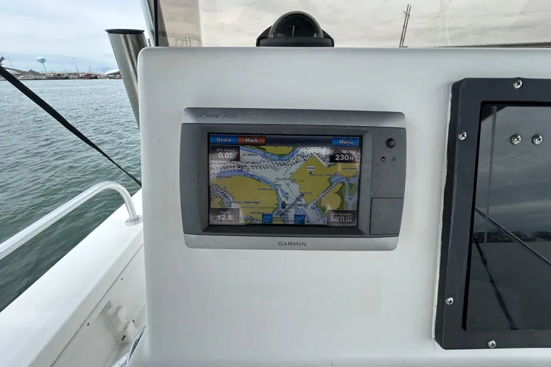 Slide: The Image of Garmin GPSmap 740s on 2009 KenCraft 2060 boat, displaying nautical navigation map. - 26