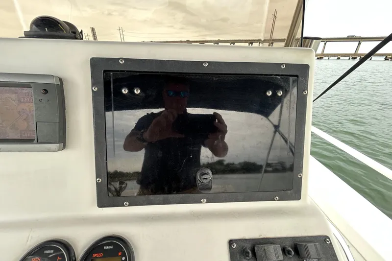 Slide: The Image of Console of a 2009 KenCraft 2060 boat with reflection and navigation equipment. - 27