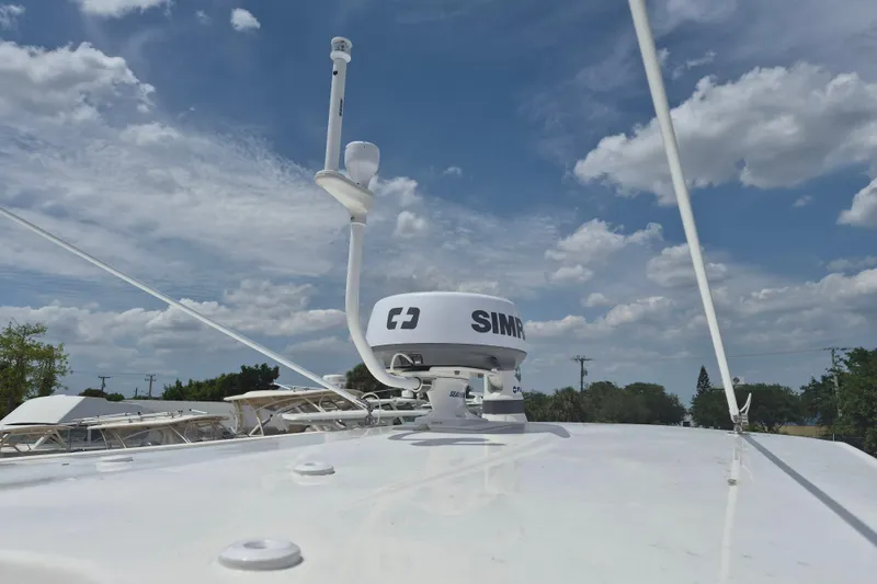 Slide: The Image of Robalo R247 Dual Console 2021 with Simrad radar under a cloudy sky. - 5