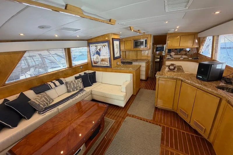 Slide: The Image of Luxurious interior of a 1995 Bertram 60 Convertible yacht with elegant wood finishes. - 17