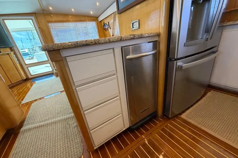 Slide: The Image of Interior of 1995 Bertram 60 Convertible yacht kitchen with modern appliances. - 22